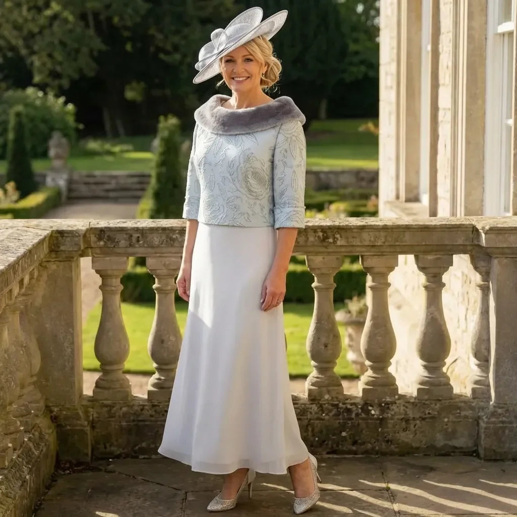 Lizabella Dress 7168 in silver and ice blue, full outfit view with embroidered V‑neck bodice, pearls, rhinestones and chiffon skirt.

