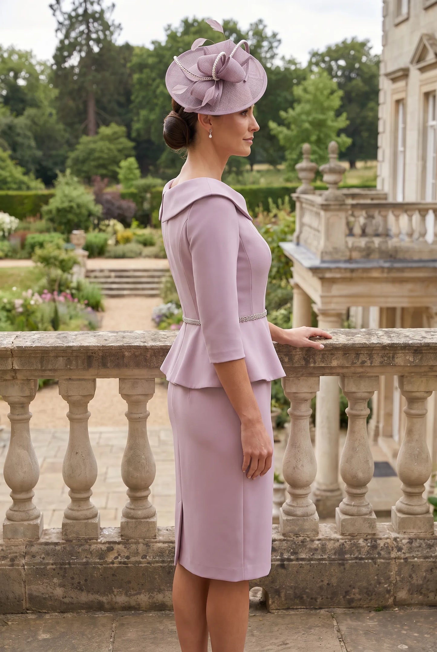 Side view of the John Charles 26701A Mauve Mother of the Bride dress showing the flattering peplum silhouette and three-quarter sleeves.
