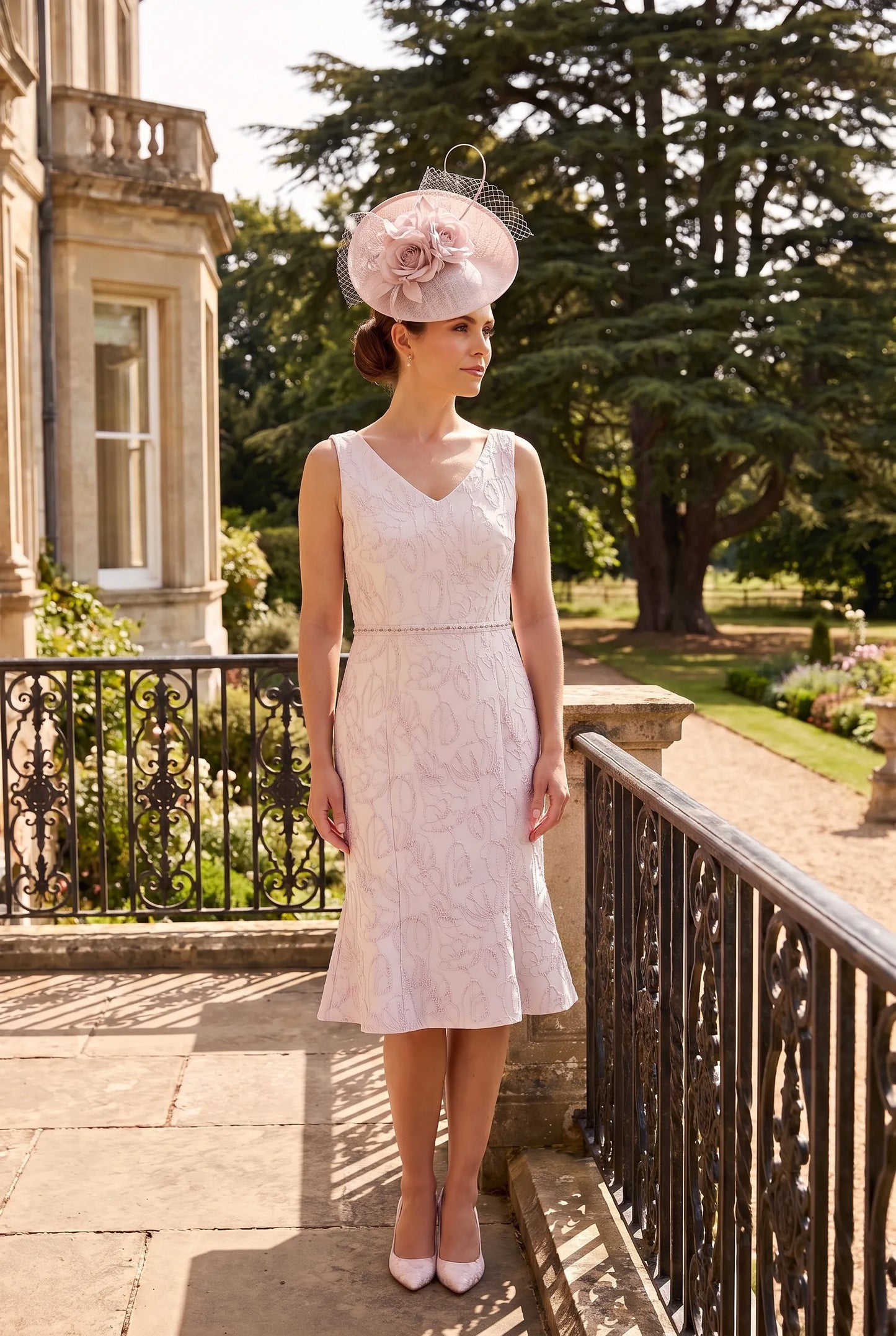 Sleeveless Pink Mother of the Bride Dress by Lizabella 7153 showing the flattering silhouette and embellished waistband.