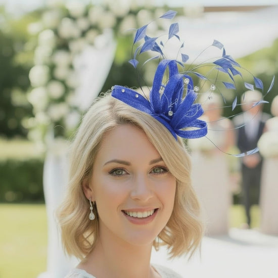 Woman wearing a cobalt blue fascinator at a wedding. Signature Dress
