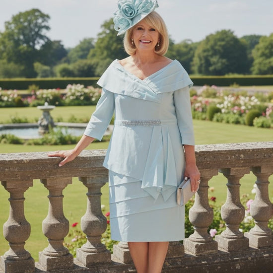 a woman wearing a mint mother of the bride dress from veromia - signature dress