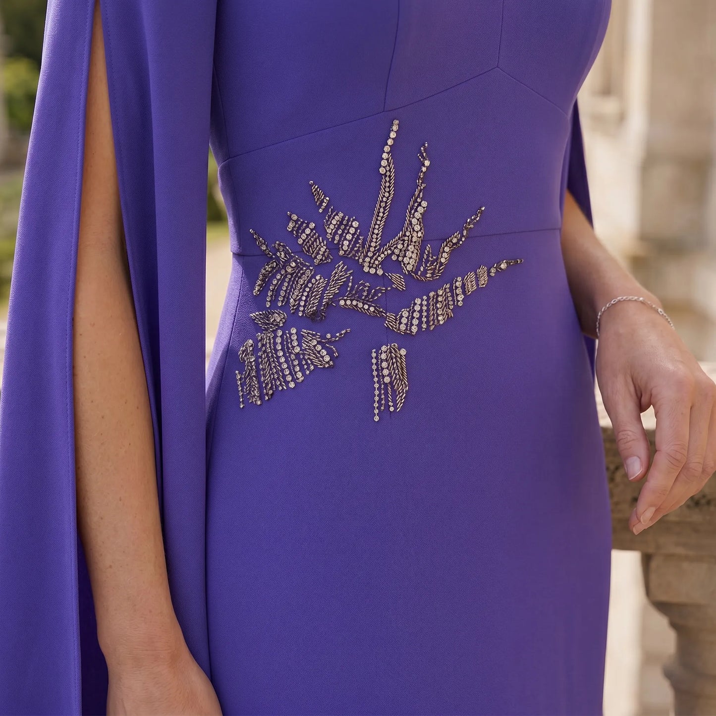 Purple dress with decorative elements on a blurred background