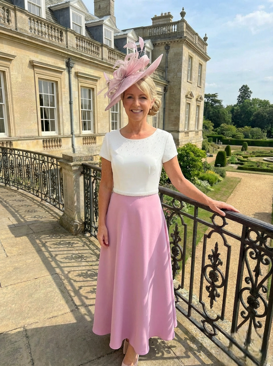 Front view of the Richard Designs RDAD1159 pink mother of the bride Aâ€‘line dress with matching pink fascinator