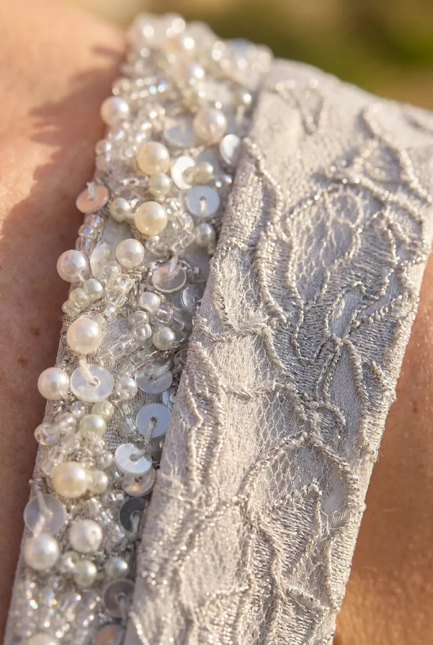 Close-up of the pearl and crystal embellished cuff on the John Charles 26438B matching jacket