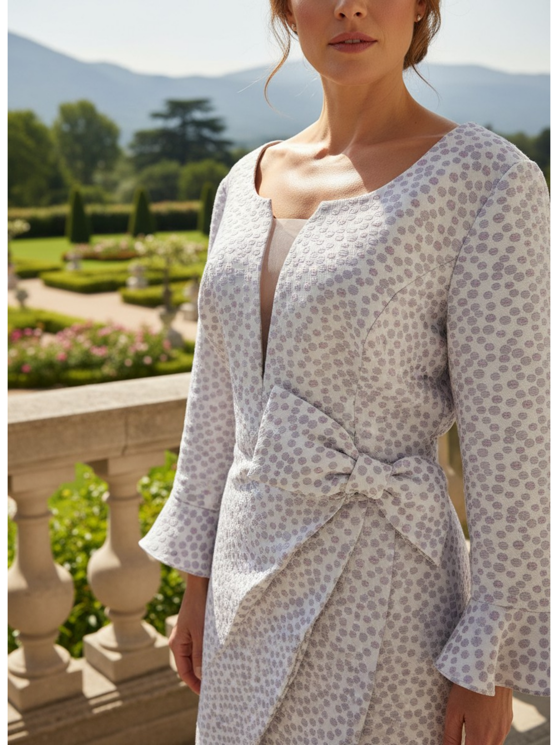 Close-up of lilac Veromia DU458 dress showing mesh insert and metallic stretch fabric.