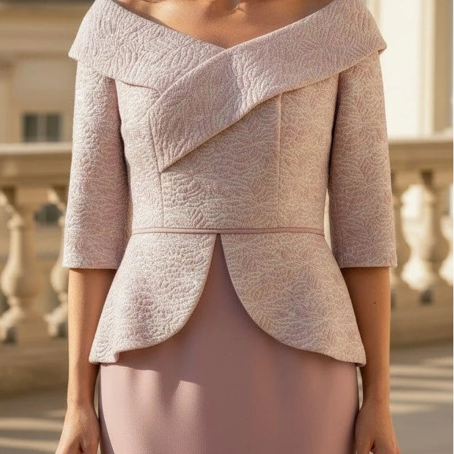 Close-up of rose pink Veromia VO7705 dress showing jacquard shimmer and structured Bardot neckline.